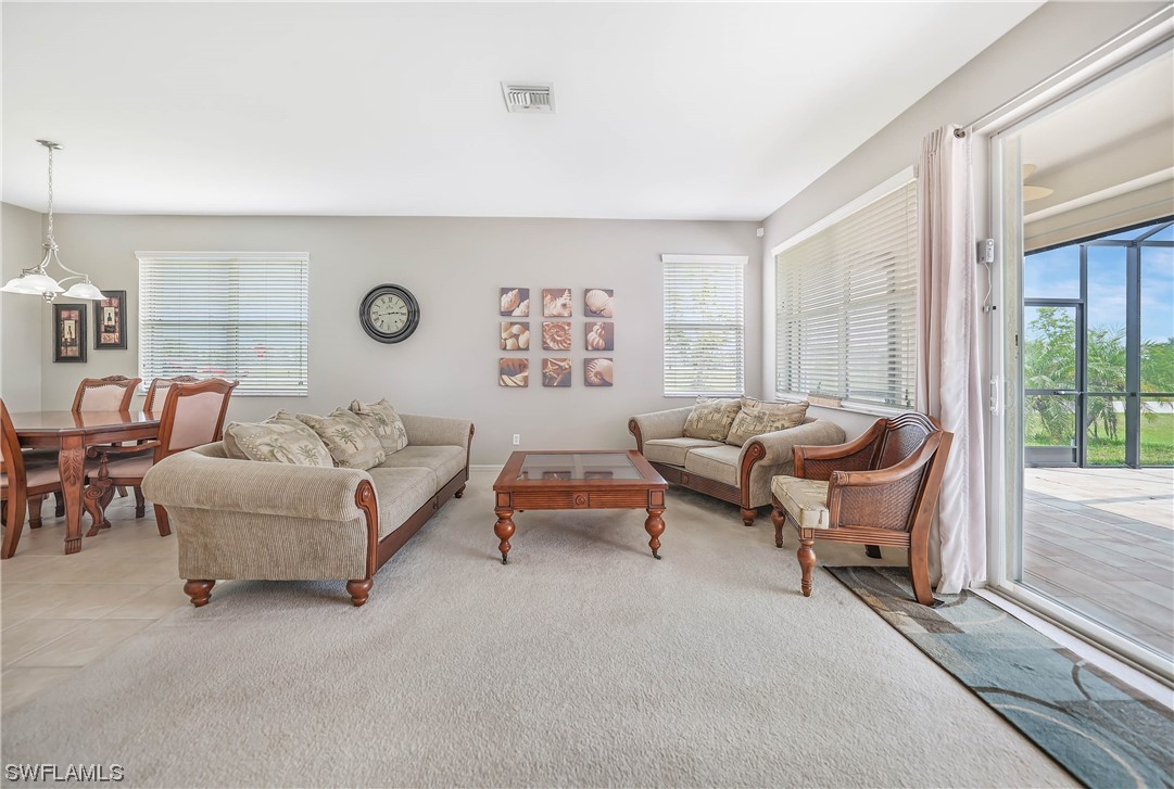 24501 Cabana Road Punta Gorda, FL 33955 - Photo 12 of 39 a living room with furniture and a large window