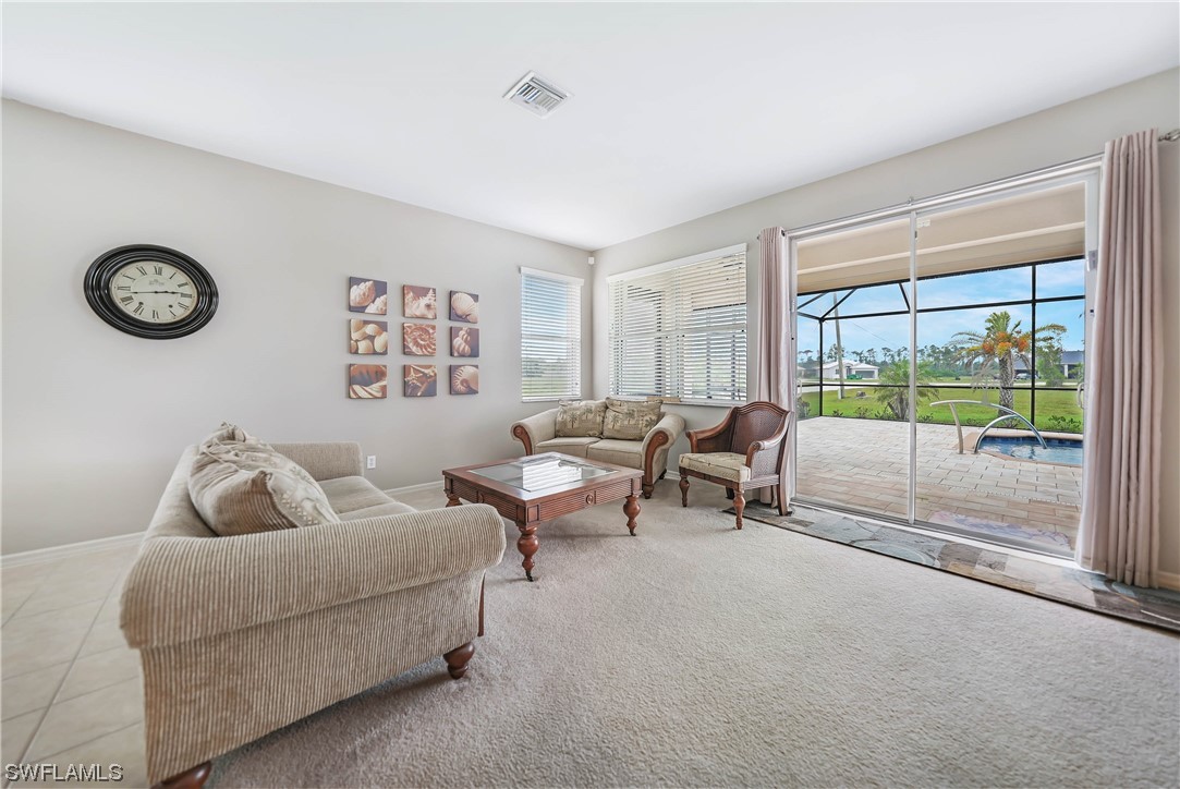 24501 Cabana Road Punta Gorda, FL 33955 - Photo 13 of 39 a living room with furniture and a window