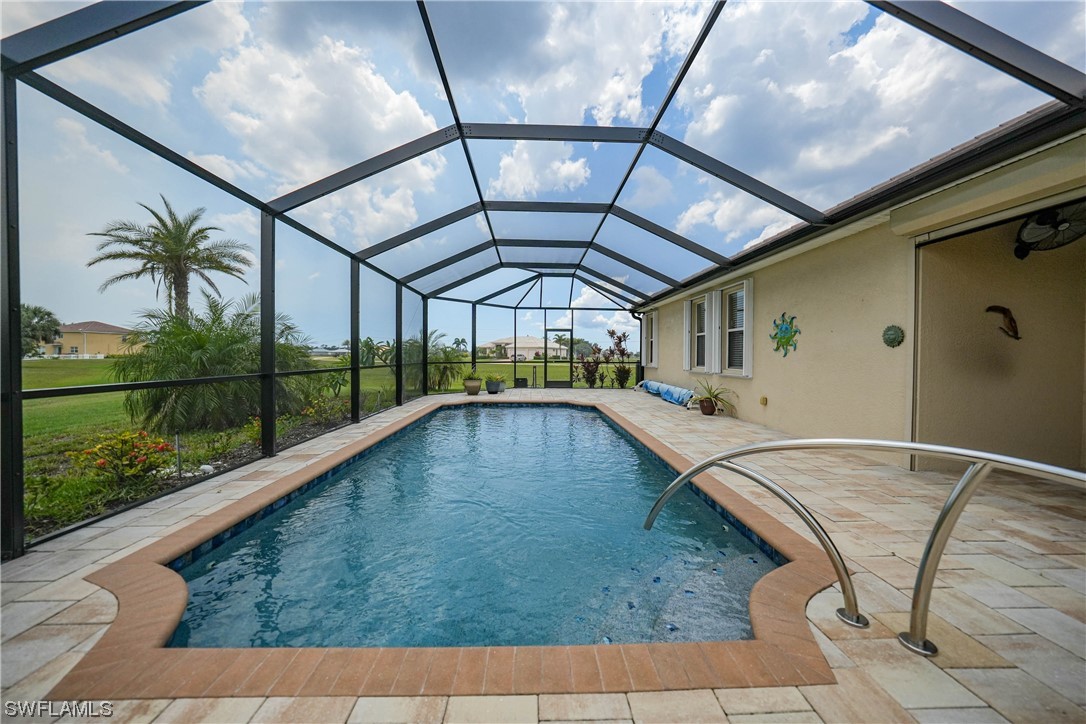 24501 Cabana Road Punta Gorda, FL 33955 - Photo 16 of 39 a view of a swimming pool with a porch