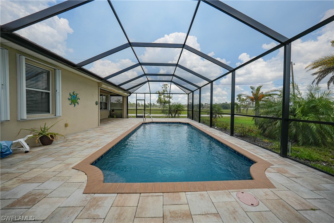 24501 Cabana Road Punta Gorda, FL 33955 - Photo 18 of 39 a view of a swimming pool with a porch