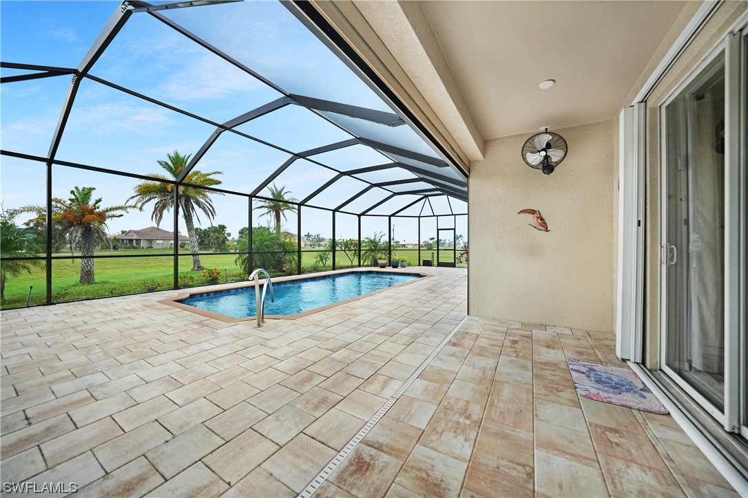 24501 Cabana Road Punta Gorda, FL 33955 - Photo 19 of 39 a view of swimming pool with seating space and wooden fence