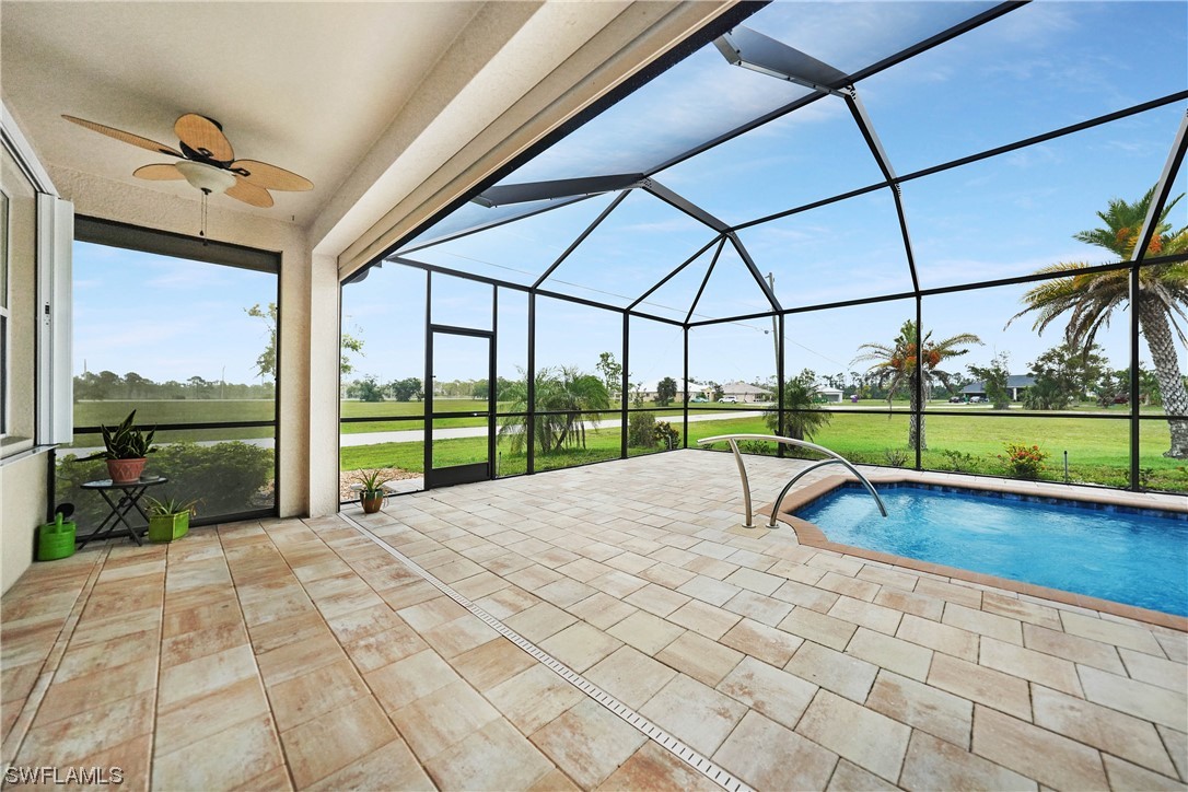 24501 Cabana Road Punta Gorda, FL 33955 - Photo 20 of 39 a view of a swimming pool with a porch