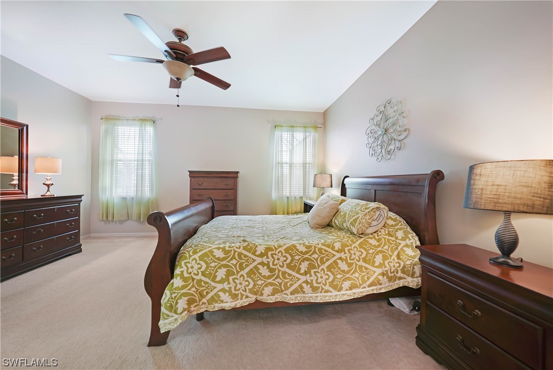 24501 Cabana Road Punta Gorda, FL 33955 - Photo 21 of 39 a bedroom with a bed and wooden floor