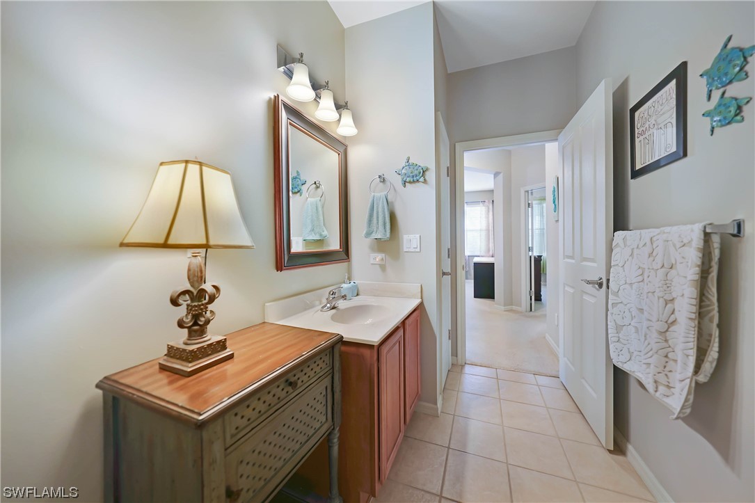 24501 Cabana Road Punta Gorda, FL 33955 - Photo 28 of 39 a bathroom with a sink vanity and a mirror