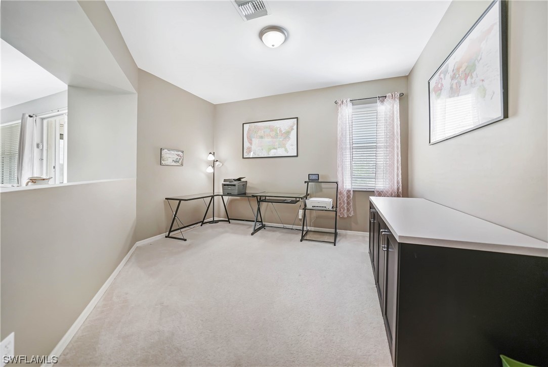 24501 Cabana Road Punta Gorda, FL 33955 - Photo 31 of 39 a living room with furniture and a window