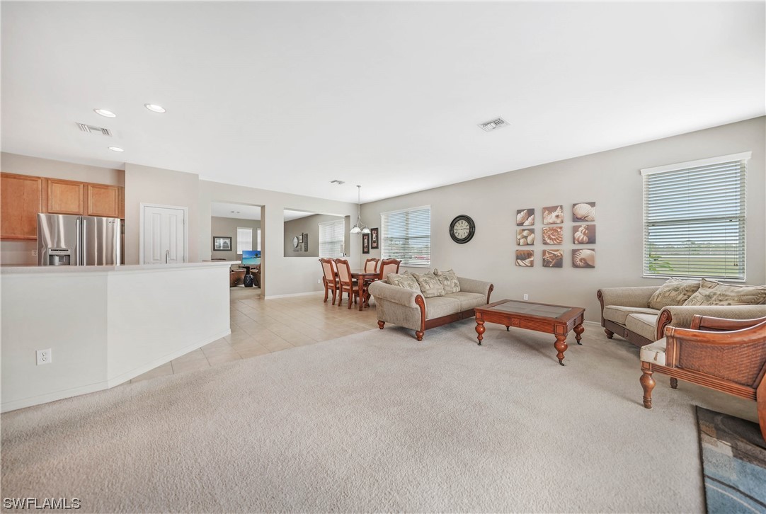 24501 Cabana Road Punta Gorda, FL 33955 - Photo 7 of 39 a living room with furniture and a large window