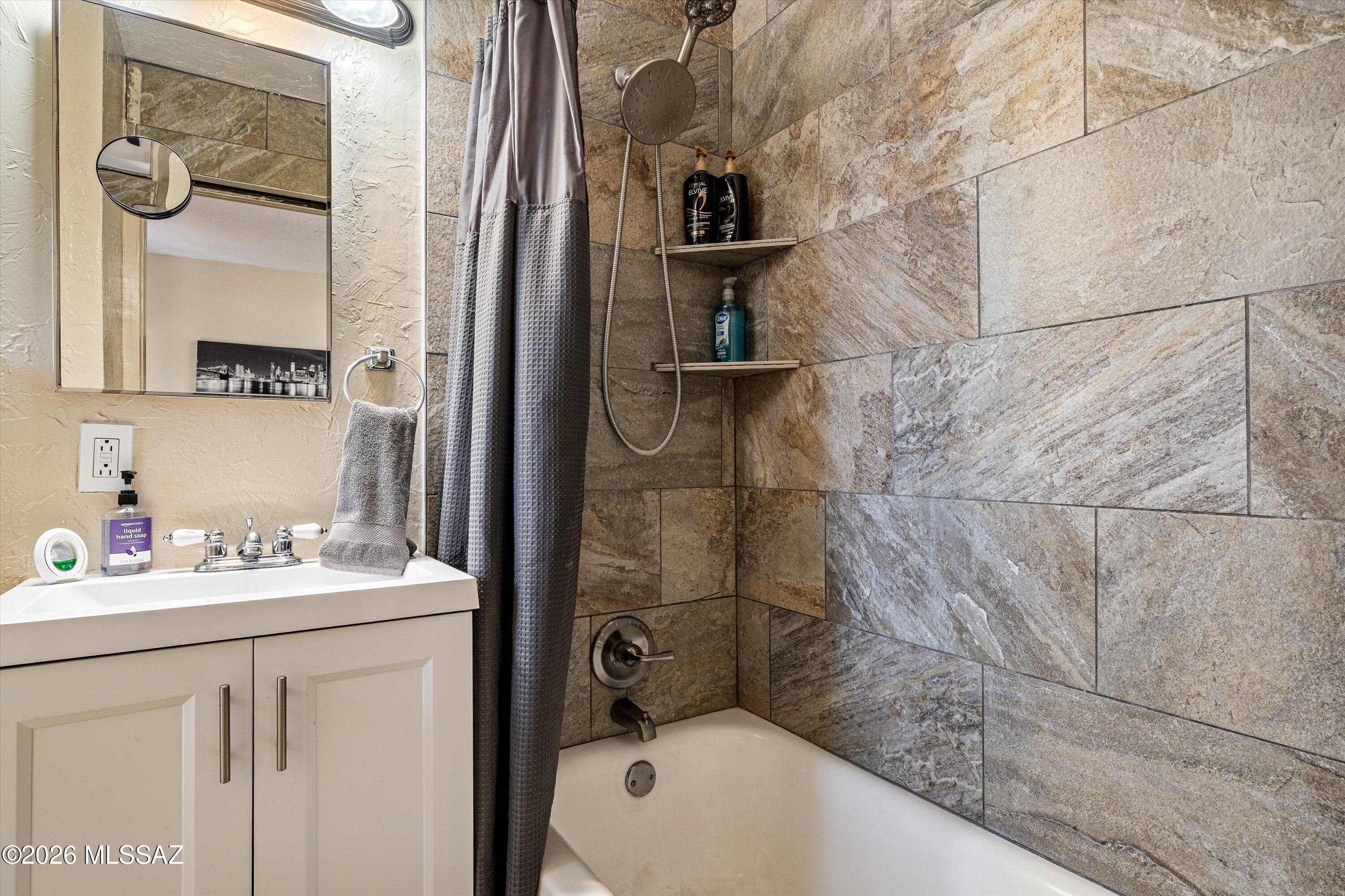 2619 East Prince Road Tucson, AZ 85716 - Photo 32 of 50 a bathroom with a sink a toilet and shower