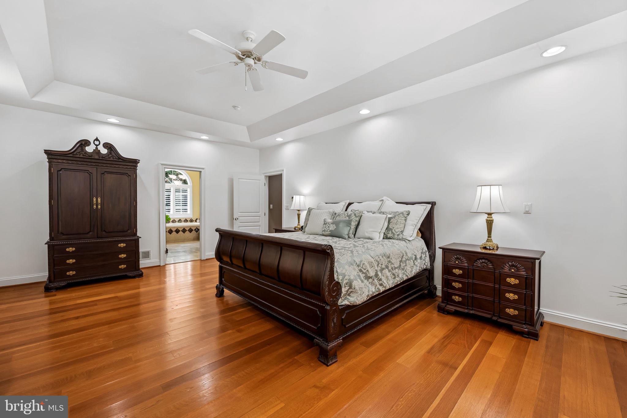 2214 Blue Mt Road Monkton, MD 21111 - Photo 29 of 68 a spacious bedroom with a bed and a flat screen tv