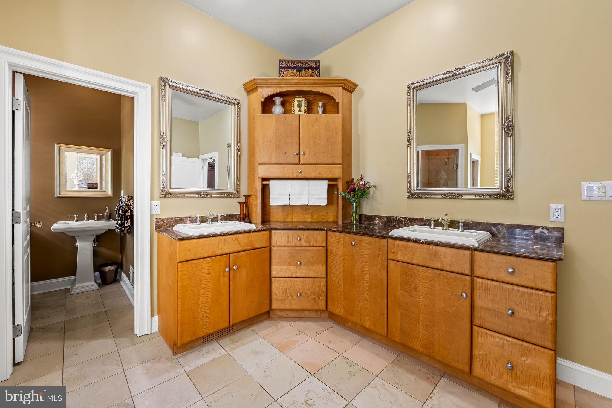 2214 Blue Mt Road Monkton, MD 21111 - Photo 31 of 68 a spacious bathroom with a granite countertop sink and a mirror