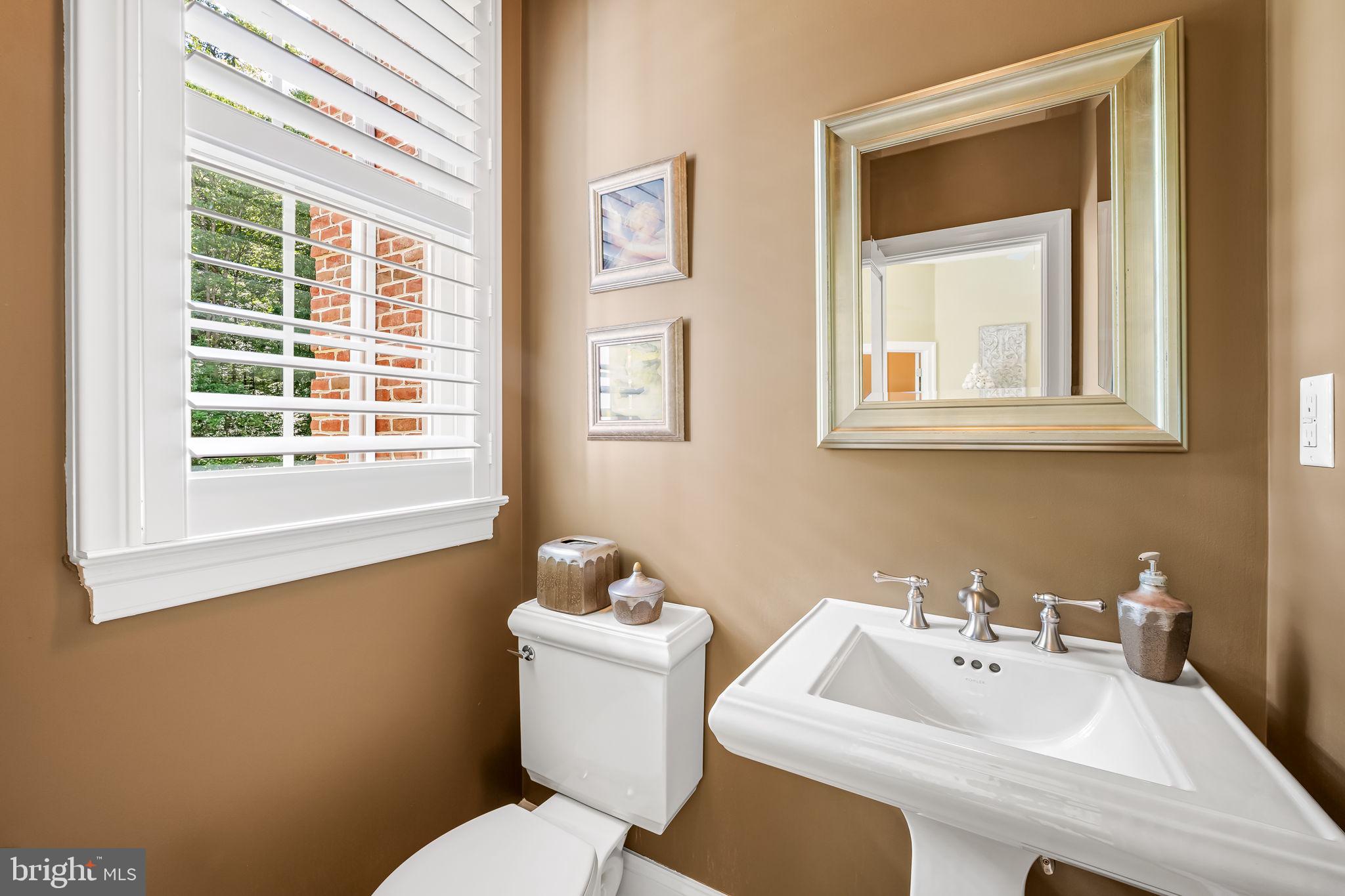 2214 Blue Mt Road Monkton, MD 21111 - Photo 33 of 68 a bathroom with a sink mirror and toilet