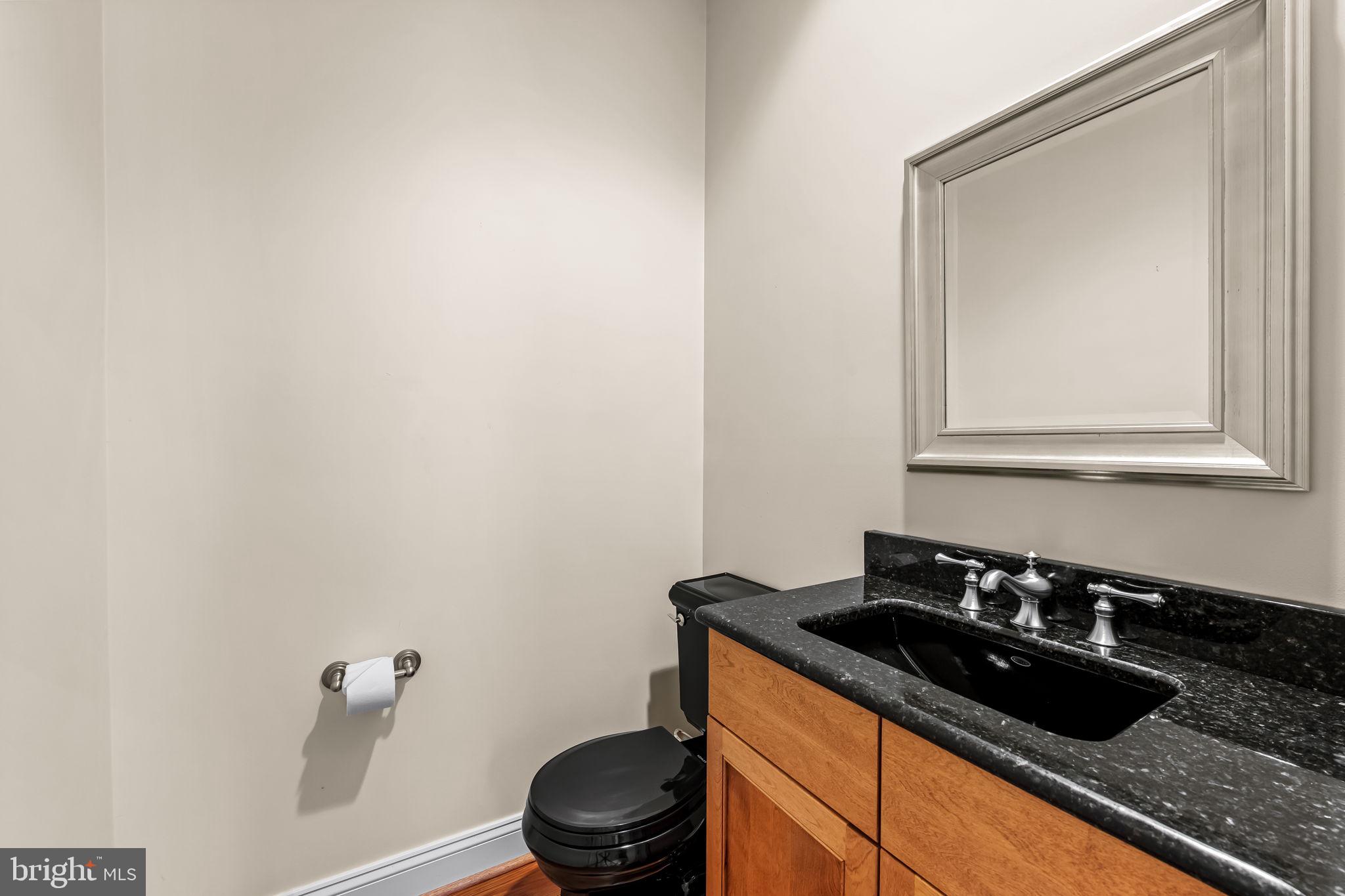 2214 Blue Mt Road Monkton, MD 21111 - Photo 49 of 68 a bathroom with a granite countertop sink and a mirror