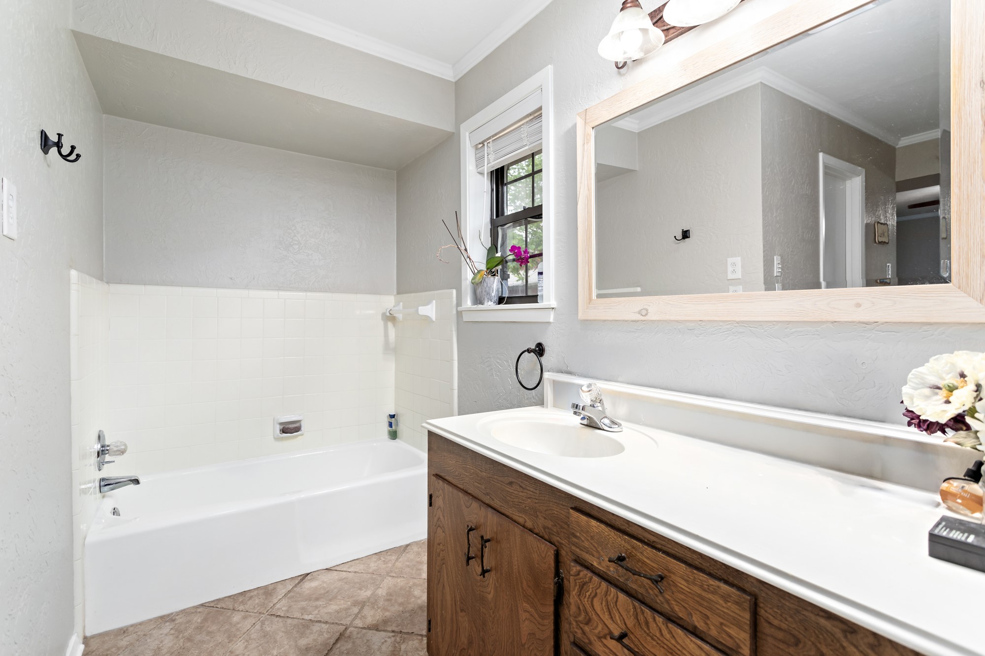 1747 Farm To Market Road 365 Nome, TX 77629 - Photo 17 of 24 a bathroom with a tub sink and mirror