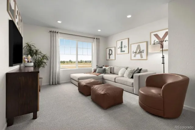 a spacious bedroom with a bed and a couch