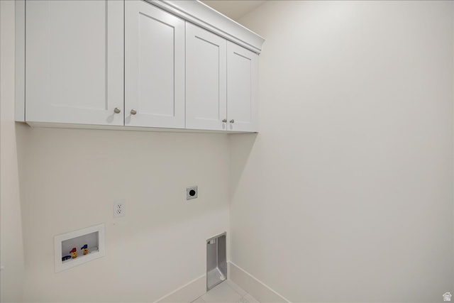 952 Mathilda Drive, Unit 156 Saratoga Springs, UT 84045 - Photo 17 of 25 Laundry area featuring white shaker-style cabinetry with crown molding, wall-mounted electrical outlet, and plumbing hookups