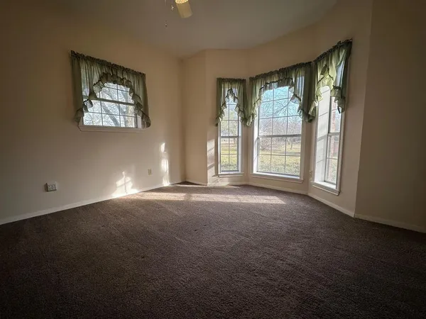a view of empty room with windows