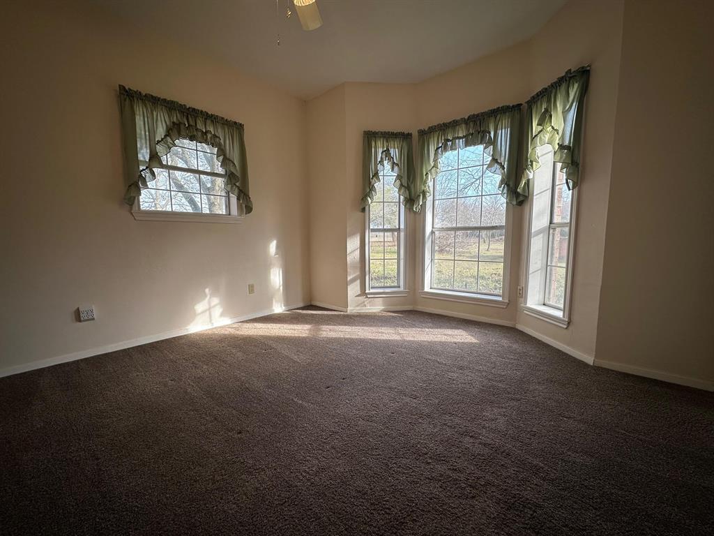 8099 Interstate 30 Frontage Road Cumby, TX 75433 - Photo 11 of 19 a view of empty room with windows