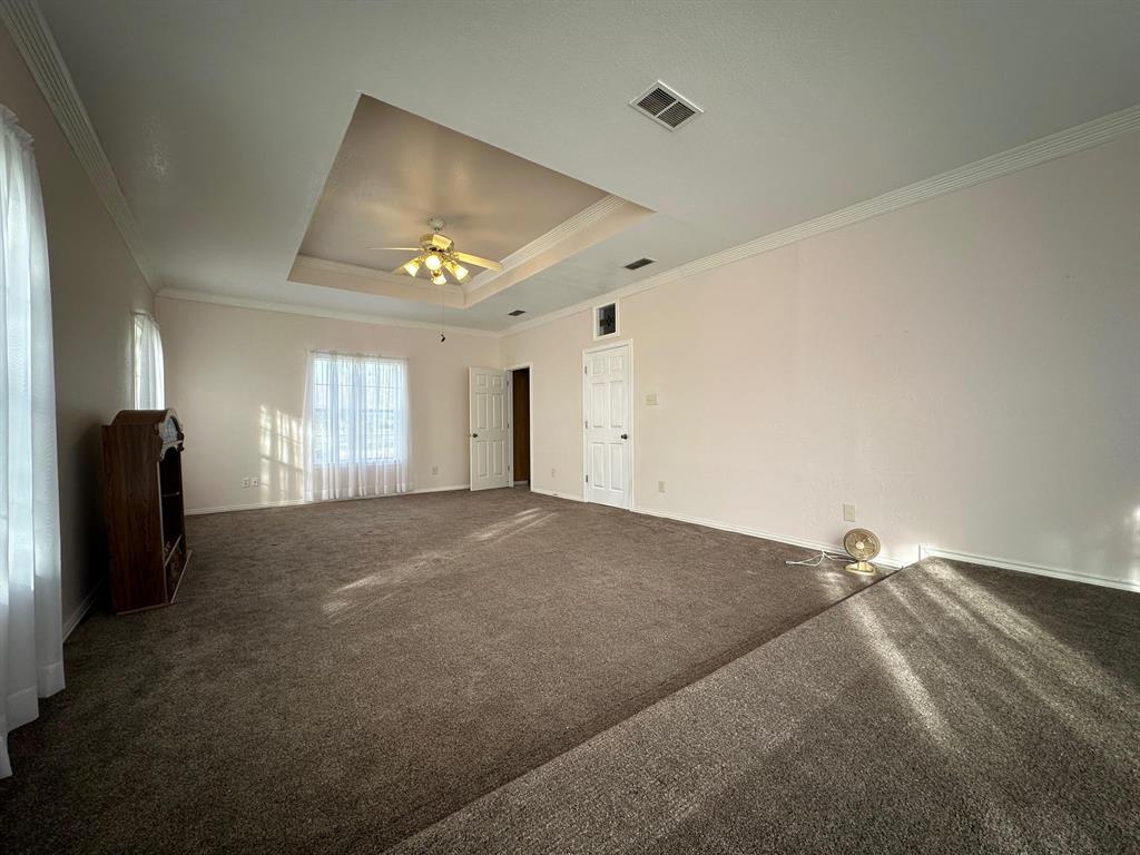8099 Interstate 30 Frontage Road Cumby, TX 75433 - Photo 19 of 19 a view of empty room with a ceiling fan and window