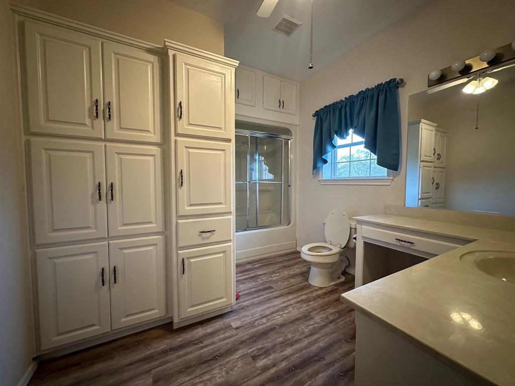 8099 Interstate 30 Frontage Road Cumby, TX 75433 - Photo 9 of 19 a room with wooden floor and furniture