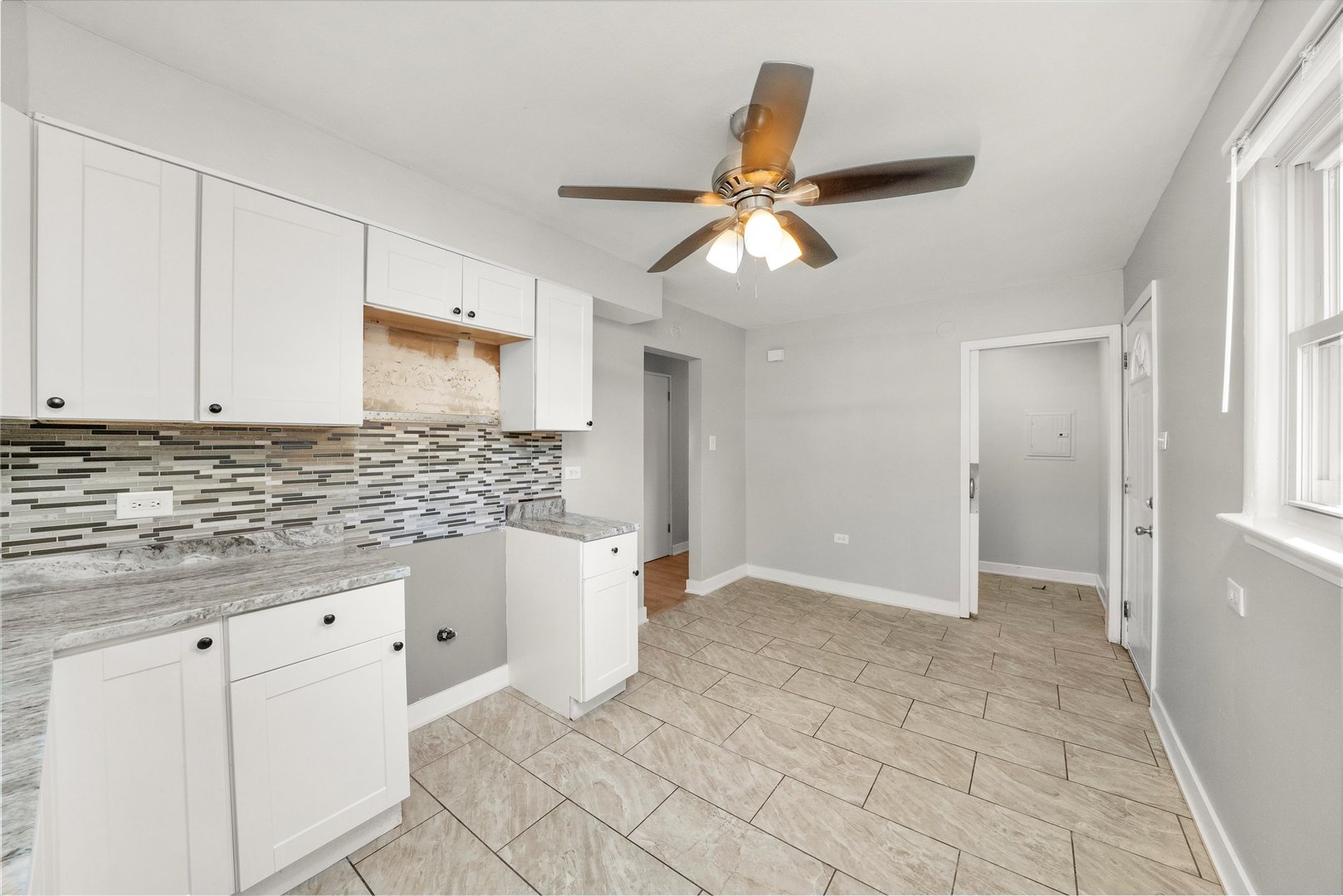 16333 Winchester Avenue Markham, IL 60428 - Photo 12 of 23 a view of a kitchen with white cabinets