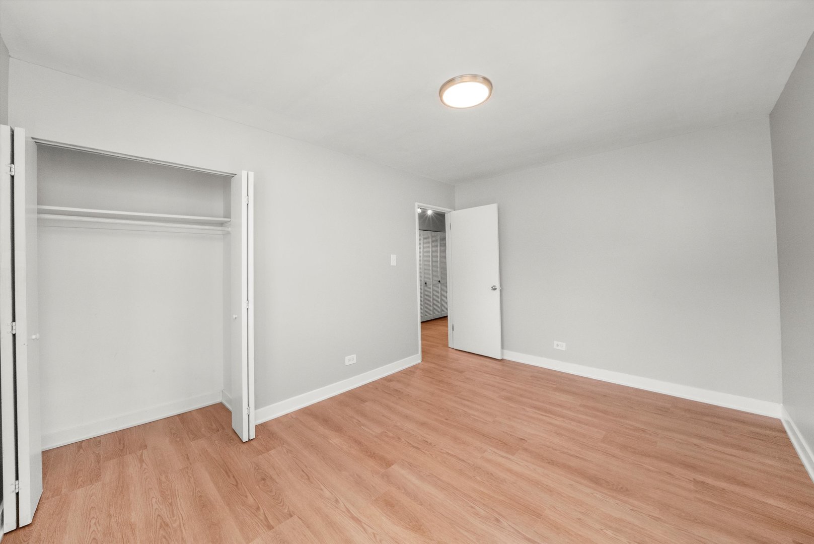 16333 Winchester Avenue Markham, IL 60428 - Photo 16 of 23 a view of an empty room with wooden floor