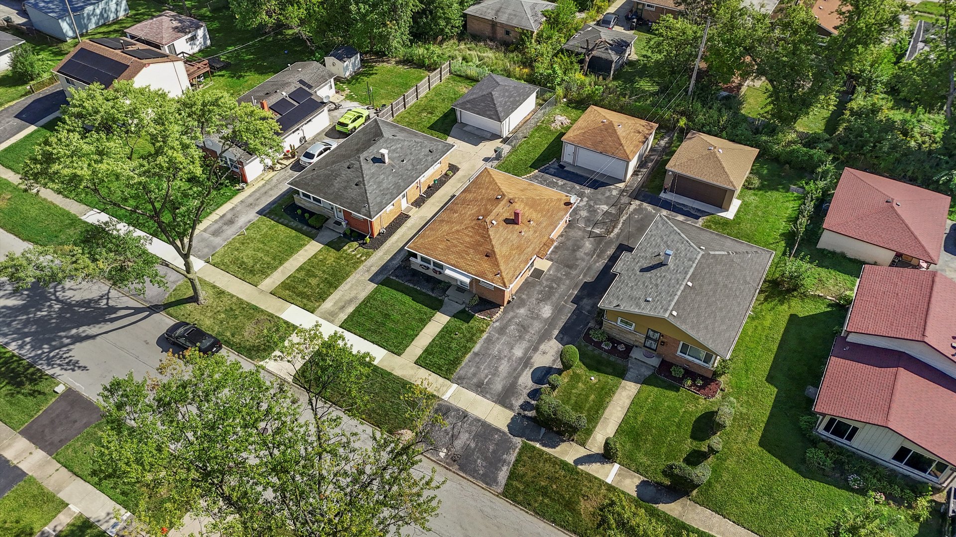 16333 Winchester Avenue Markham, IL 60428 - Photo 22 of 23 an aerial view of a house with a garden and trees