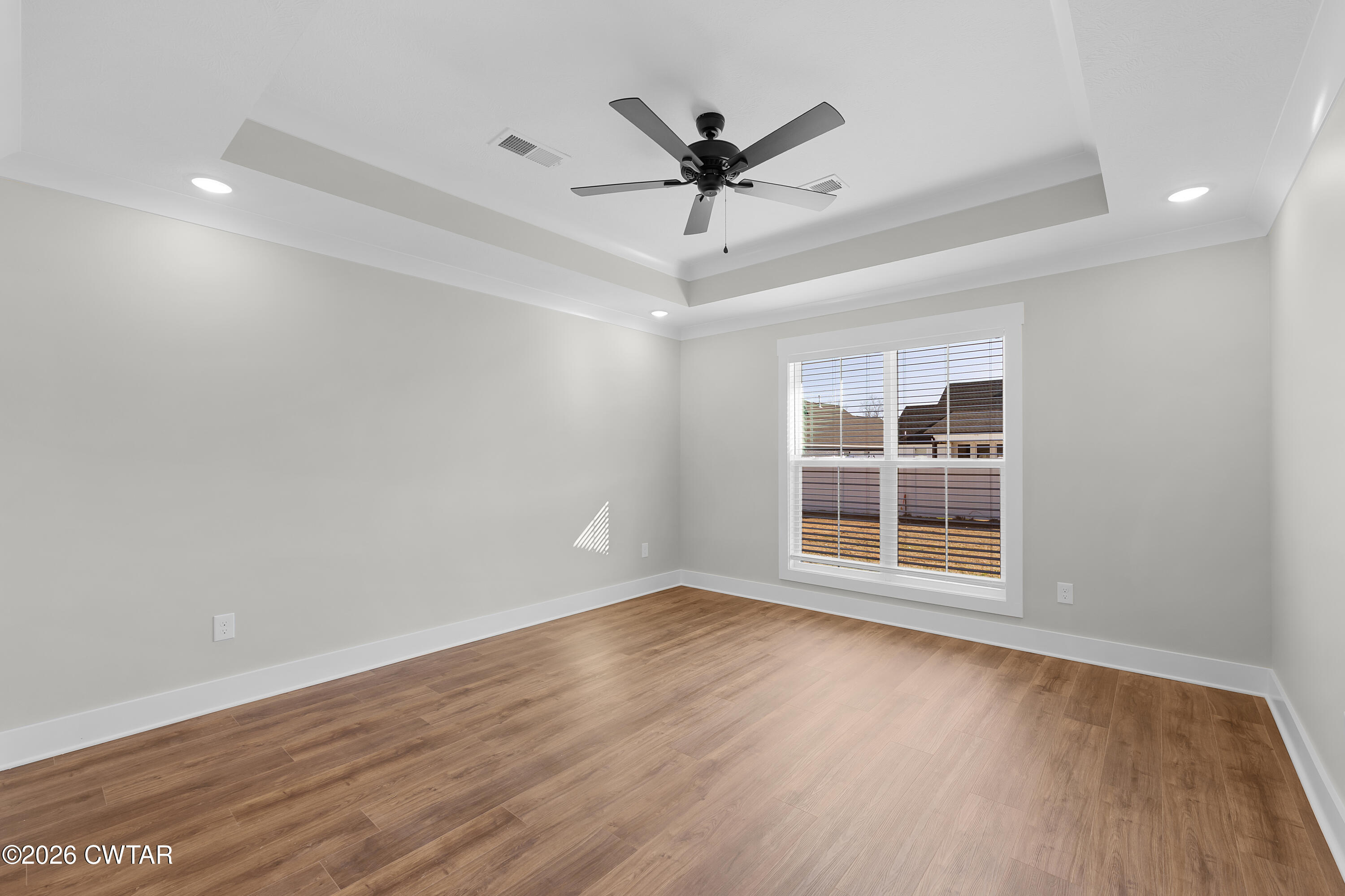 36 Easington Cove Jackson, TN 38305 - Photo 10 of 16 wooden floor in an empty room with a window