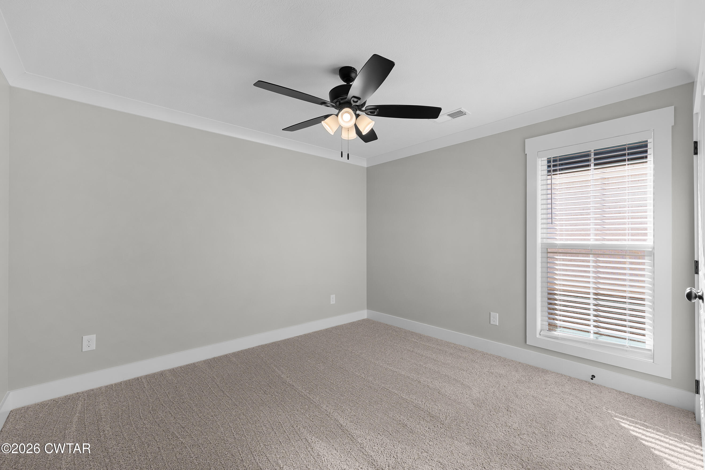 36 Easington Cove Jackson, TN 38305 - Photo 14 of 16 a view of an empty room with a window