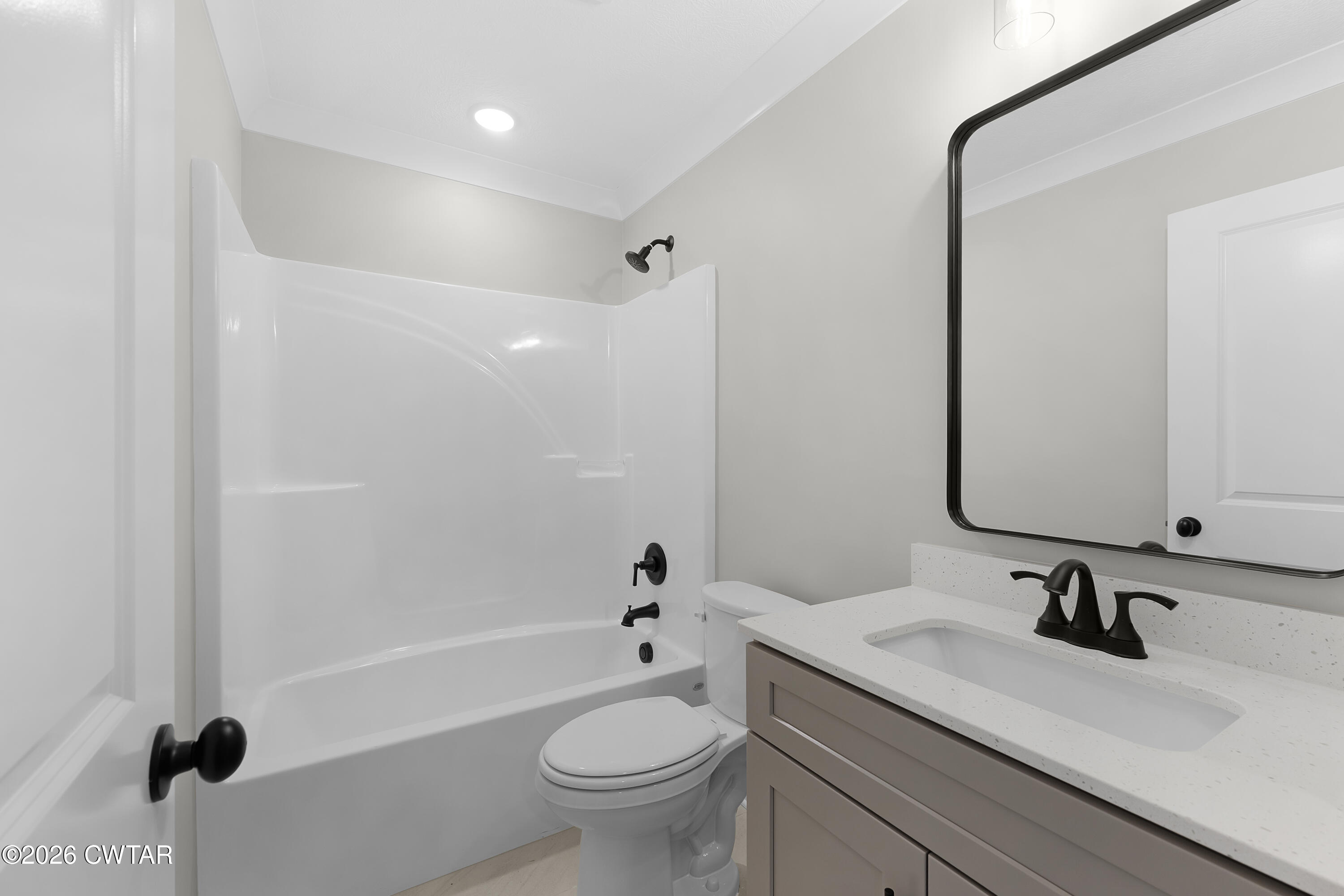 36 Easington Cove Jackson, TN 38305 - Photo 7 of 16 a bathroom with a granite countertop sink toilet mirror and shower