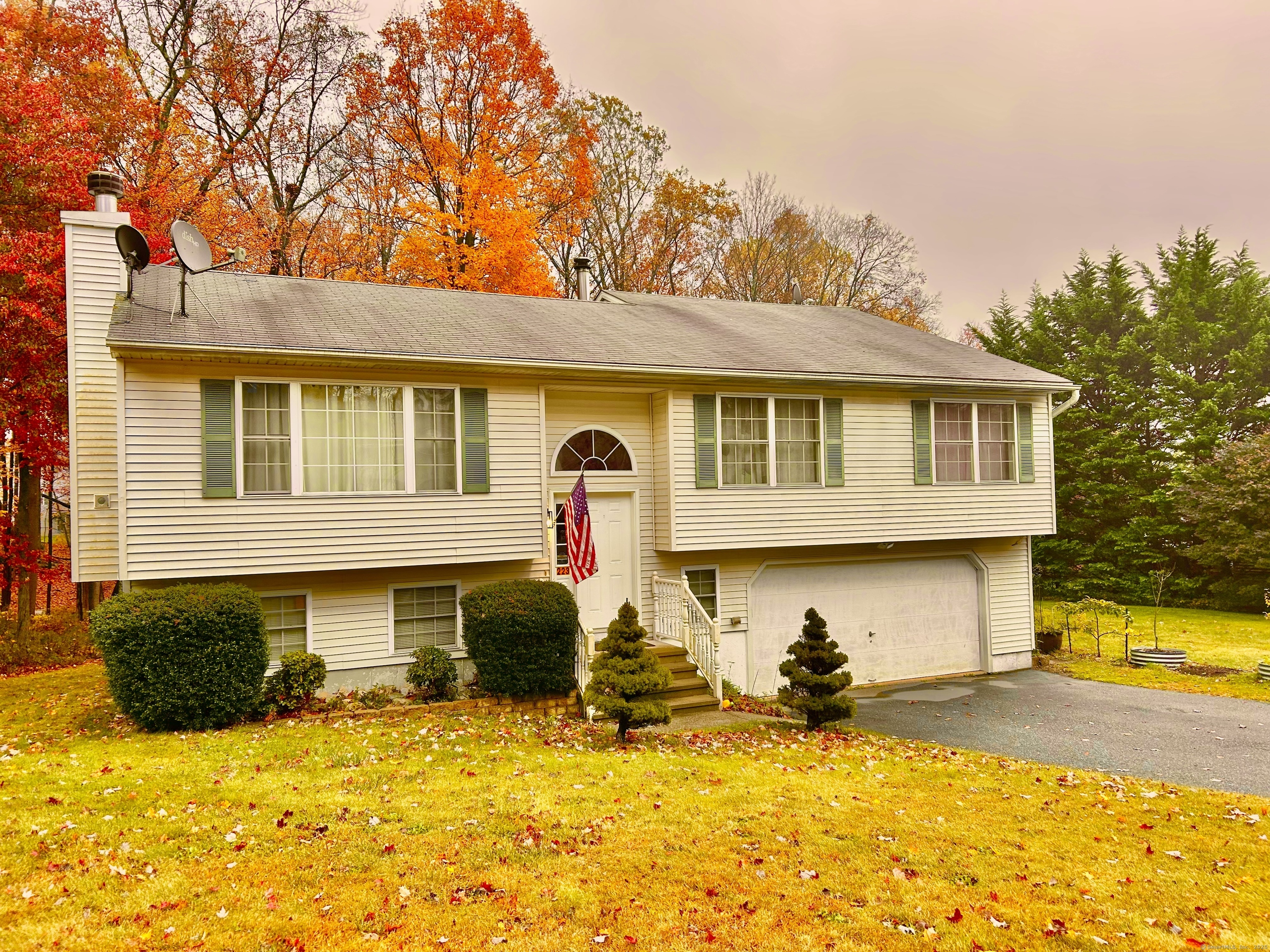 a front view of house with yard outdoor seating and barbeque oven