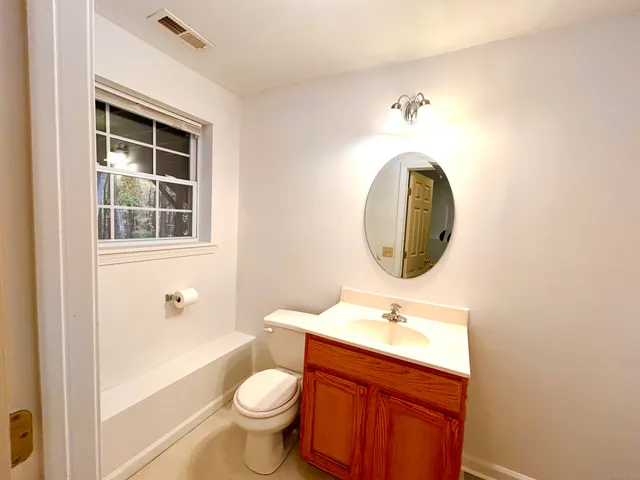 a view of an empty room with stairs