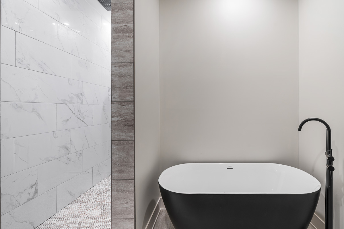 3003 West Fulton Street, Unit 1 Chicago, IL 60612 - Photo 16 of 29 a bathroom with a bathtub and shower