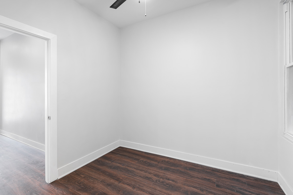 3003 West Fulton Street, Unit 1 Chicago, IL 60612 - Photo 20 of 29 a view of an empty room with wooden floor