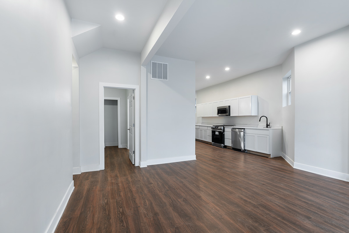 3003 West Fulton Street, Unit 1 Chicago, IL 60612 - Photo 2 of 29 a view of a kitchen with a sink cabinets and wooden floor