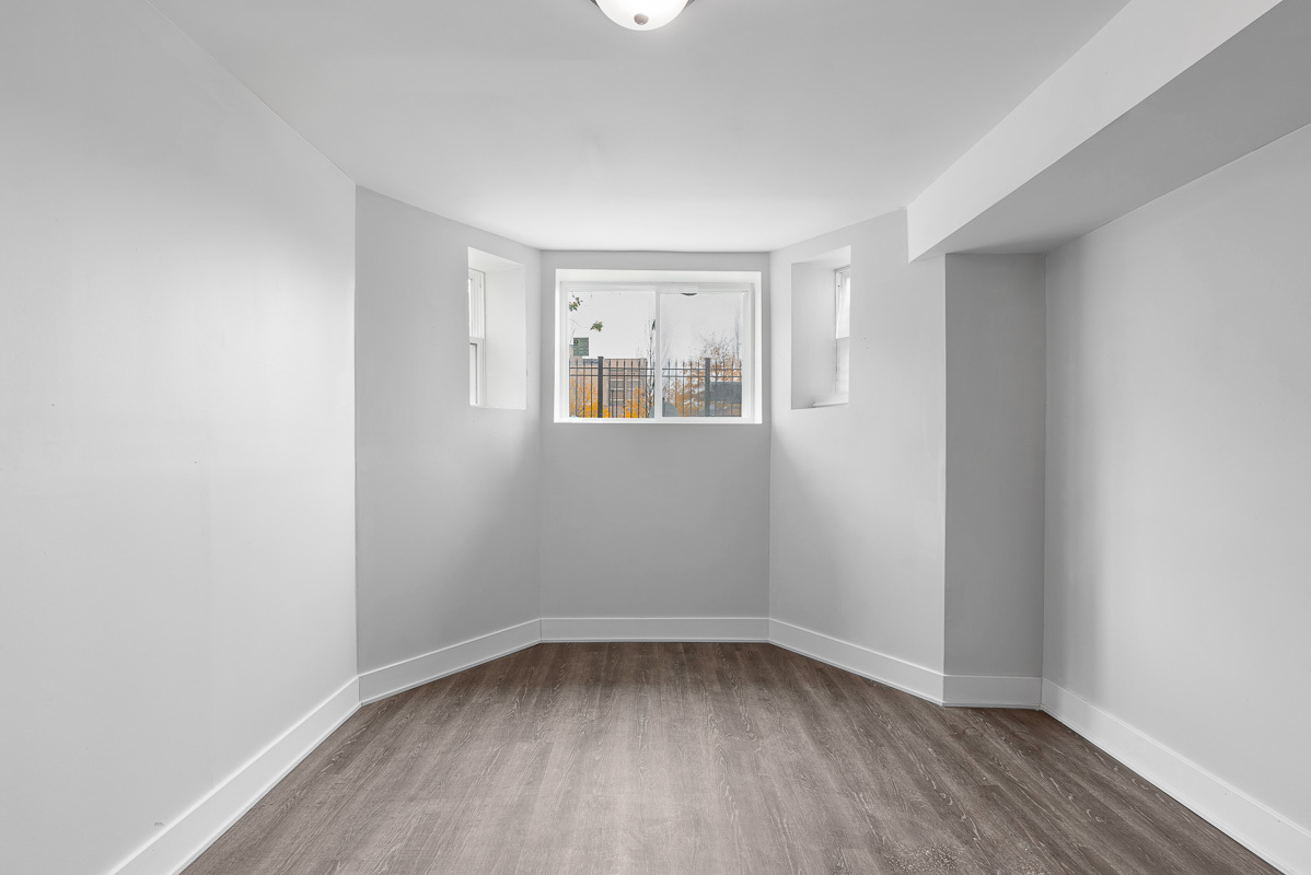 3003 West Fulton Street, Unit 1 Chicago, IL 60612 - Photo 24 of 29 wooden floor in an empty room with a window