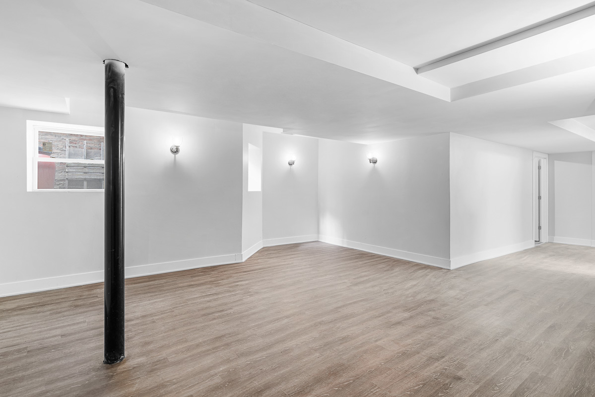 3003 West Fulton Street, Unit 1 Chicago, IL 60612 - Photo 29 of 29 a view of an empty room with wooden floor