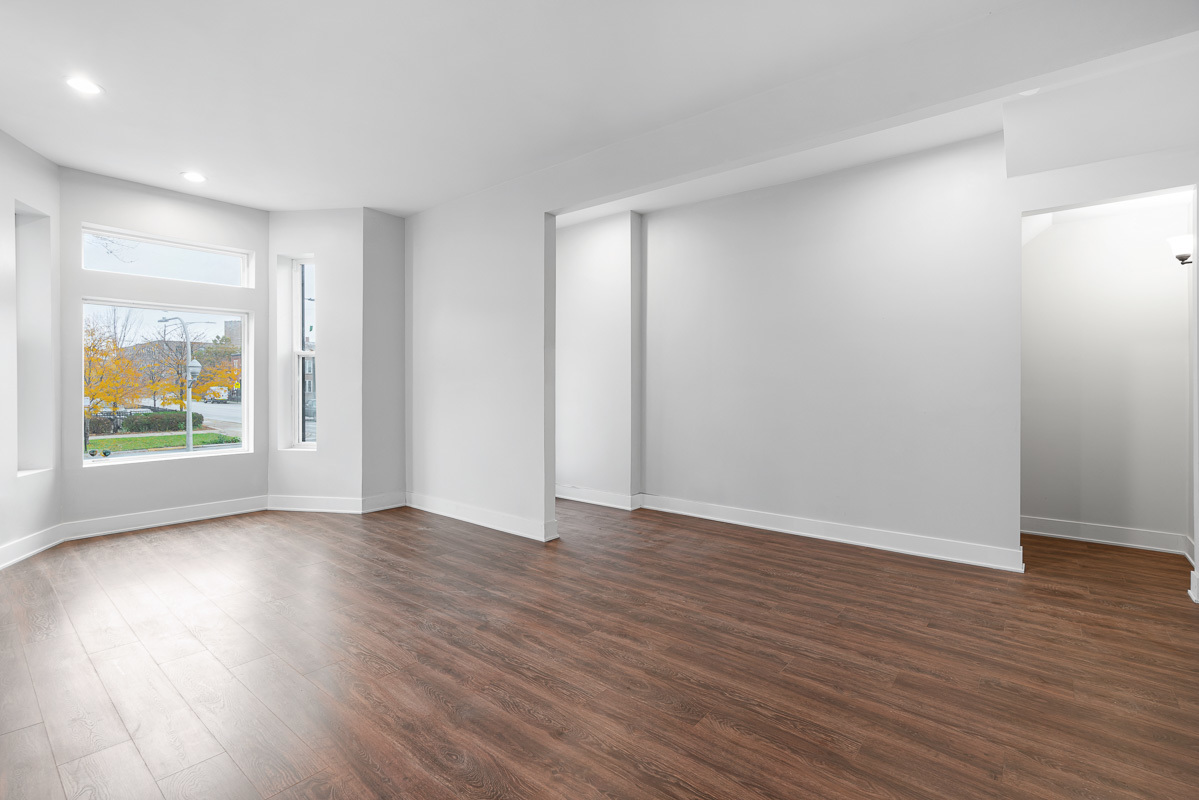 3003 West Fulton Street, Unit 1 Chicago, IL 60612 - Photo 5 of 29 a view of an empty room with wooden floor and windows