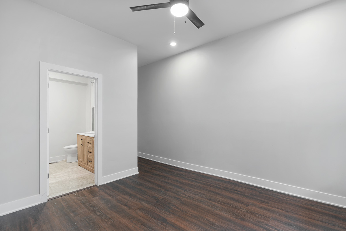 3003 West Fulton Street, Unit 1 Chicago, IL 60612 - Photo 10 of 29 wooden floor in an empty room with a window