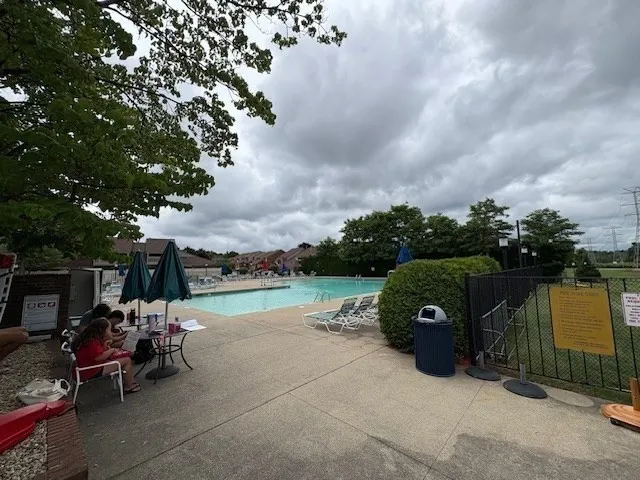 a house with lots of trees in the background