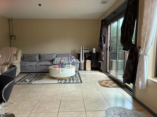 a living room with furniture and a rug