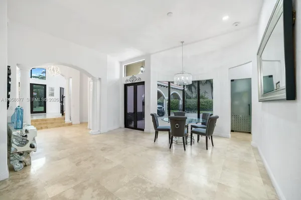 a bathroom with a granite countertop toilet a sink a shower and a mirror