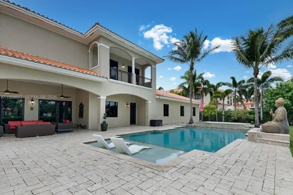 a view of a house with a yard and garage