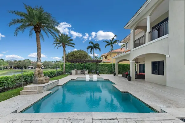 a large white bed in a white room