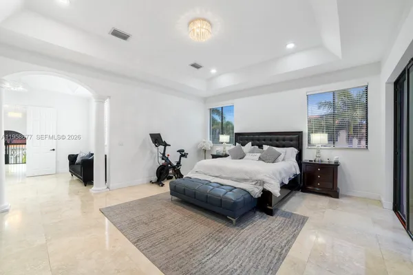 a living room with couches and a flat screen tv