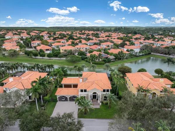 an aerial view of a house with outdoor space lake view and mountain view