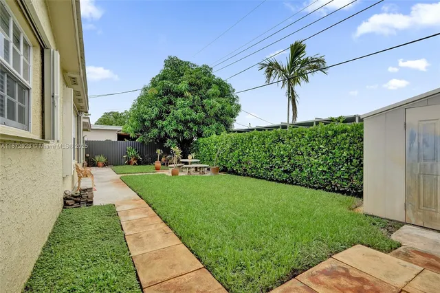 a view of a yard in front of a house