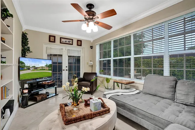 a living room with fireplace furniture and a flat screen tv