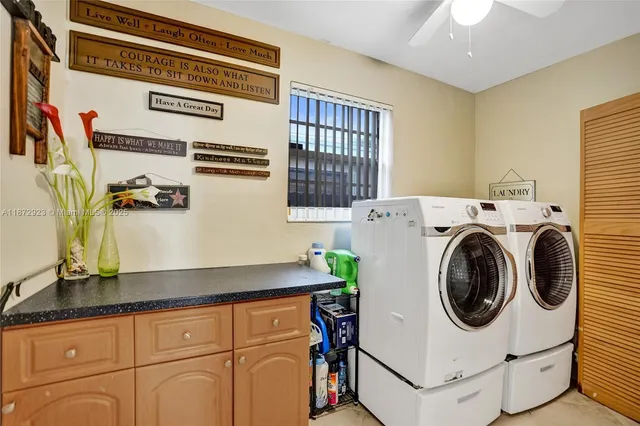 a utility room with dryer and washer
