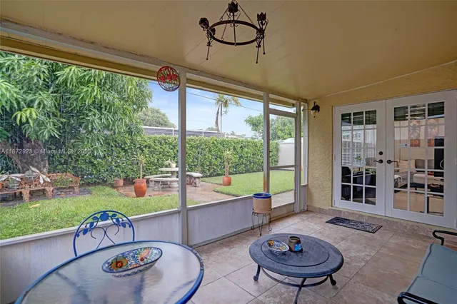a table and chairs in a garden