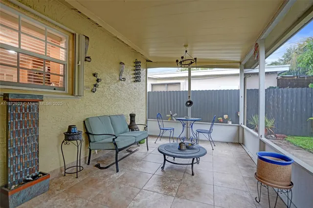a outdoor space with patio couch and chairs
