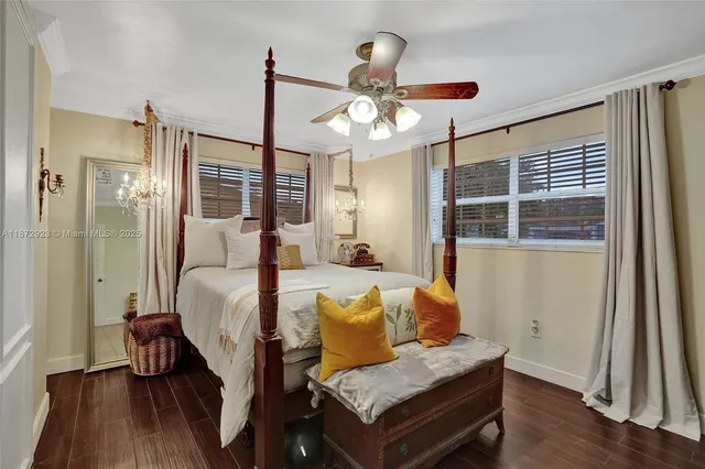 a bedroom with furniture and wooden floor